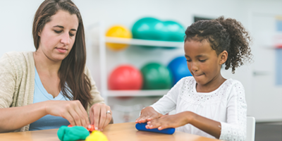 a child smiling at an ABA support session